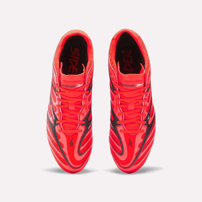 A pair of bright red Reebok Sidewinder 26 Pro Firm Ground Cleats with black detailing, viewed from directly above to highlight their ball control design.