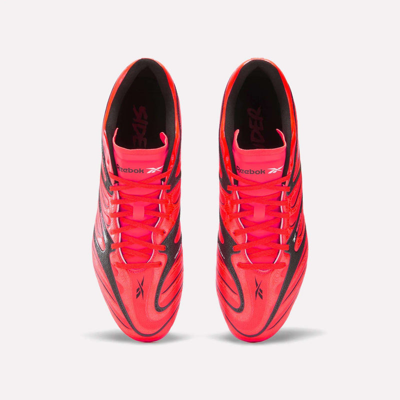 Top view of a pair of Reebok Sidewinder 26 League Firm Ground Cleats in bright pink and black with laces, featuring firm ground studs for enhanced ball control, placed side by side on a white background.