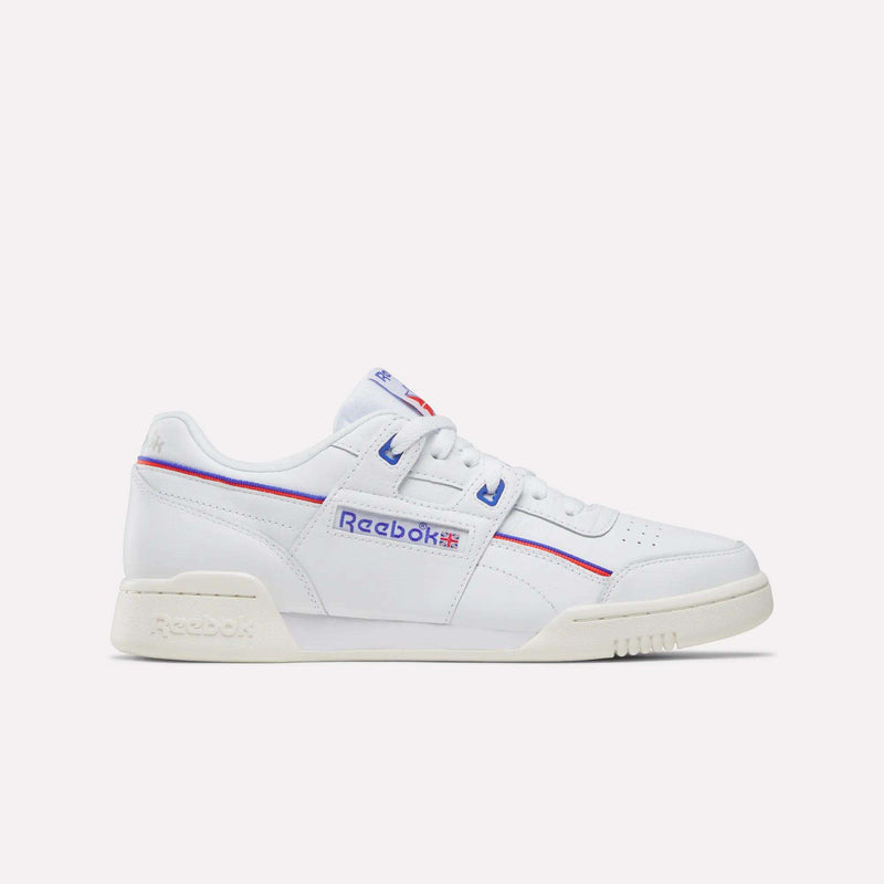 The Women's Club C 85 Shoes by Reebok feature white leather, an off-white sole, blue and red accents, and the iconic Reebok logo with a Union Jack on the side. Shown in a side view against a plain light background.