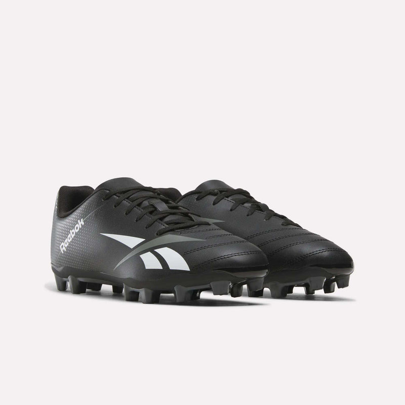 A pair of Reebok Strike Multi Ground Soccer Cleats in black, showcasing white Reebok logos, equipped with laces and studded soles suited for turf use, displayed against a plain white background.