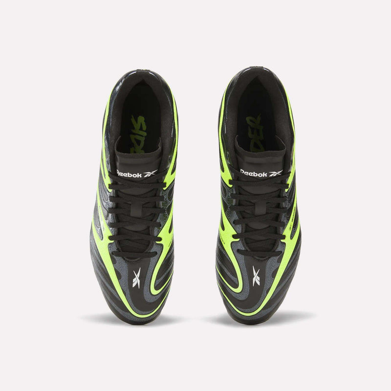 Top view of black and neon green Reebok Sidewinder 26 League FG Cleats for big kids, featuring black laces, firm ground studs, and prominent Reebok logos on the tongues and sides, placed side by side on a plain white background.