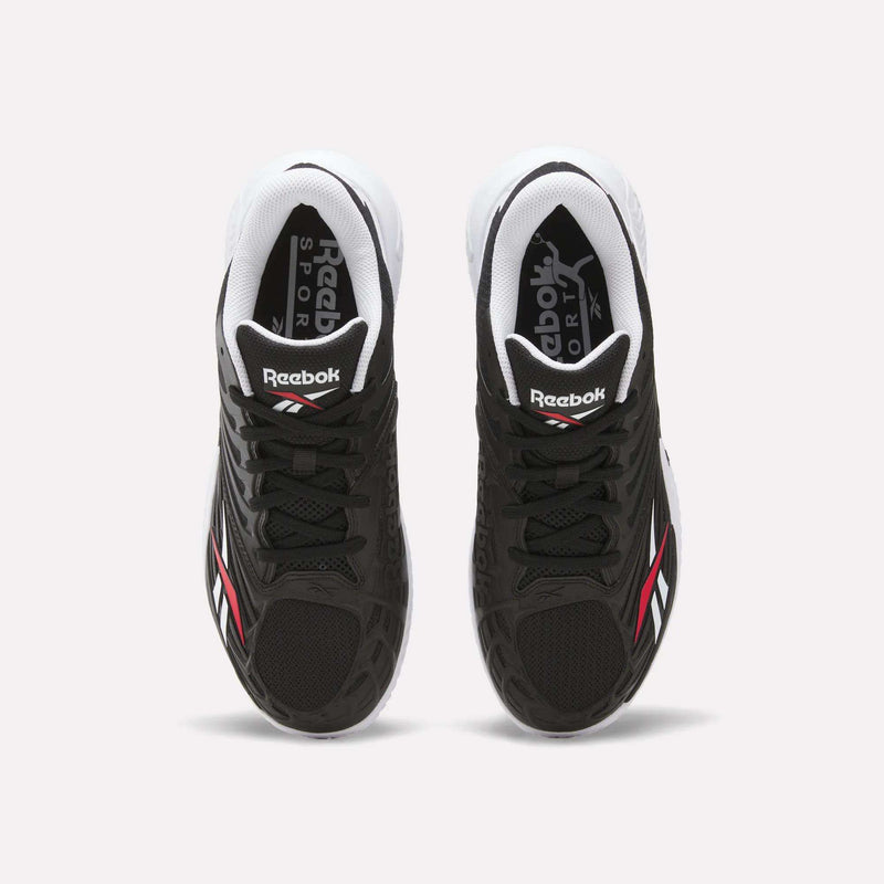 Top view of Reebok Phase EVO Tennis Shoes in black with white soles and red-white accents, featuring Reebok Sport branding on the tongue and insole—durable, responsive tennis shoes shown on a plain white background.