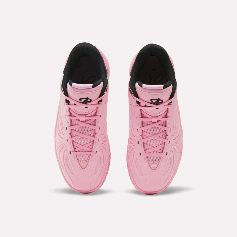 Pair of pink Angel Reese 1 athletic sneakers by Reebok with textured patterns, black lining, and a black logo on the tongue, viewed from above on a white background—these performance basketball shoes feature the Reebok Energy Return System for added comfort and support.