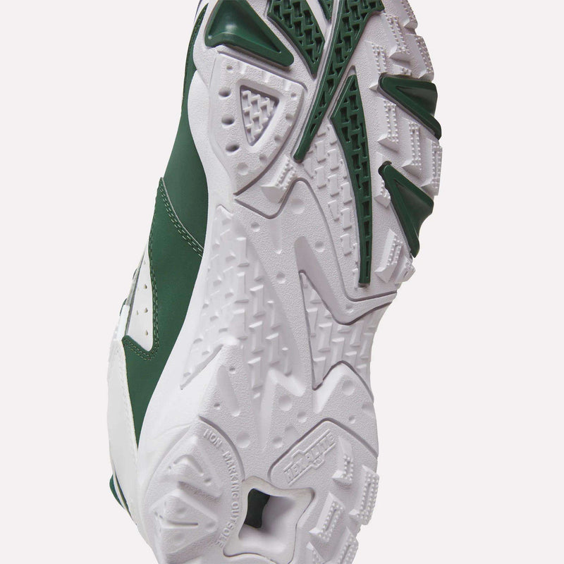 Close-up of the sole of the Reebok Brutus Low Shoes in green and white, featuring textured tread patterns and detailed rubber grip designs inspired by classic Reebok heritage styles.