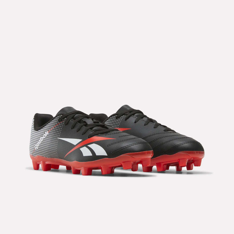 Strike Multi-Ground Soccer Shoes - Big Kids by Reebok in black and red with white accents, designed for turf play, displayed on a plain white background.