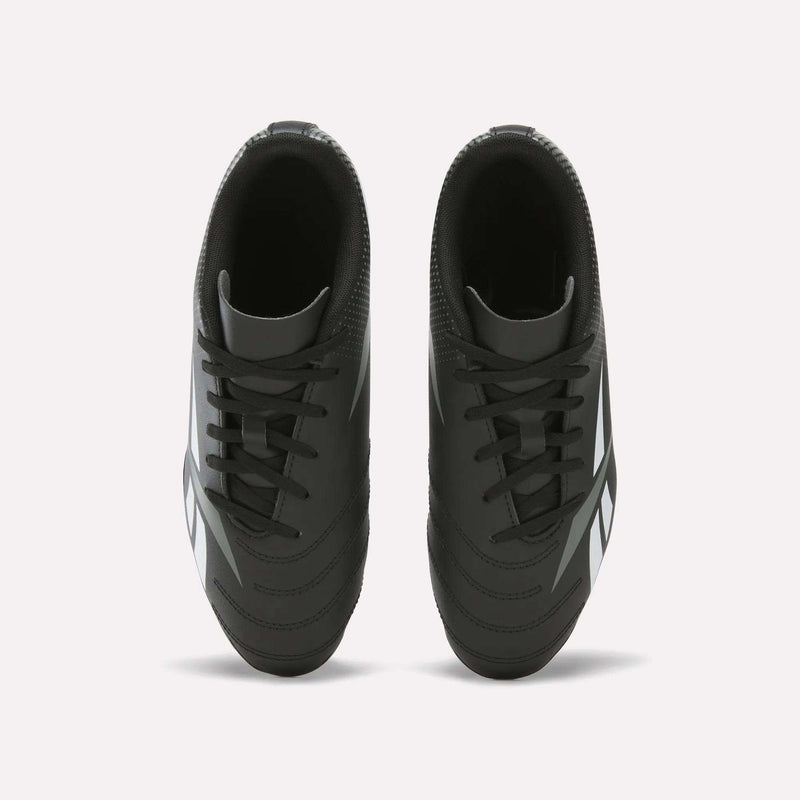 A pair of Reebok Strike Multi-Ground Soccer Shoes - Big Kids in black with white accents, shown from above on a plain white background.