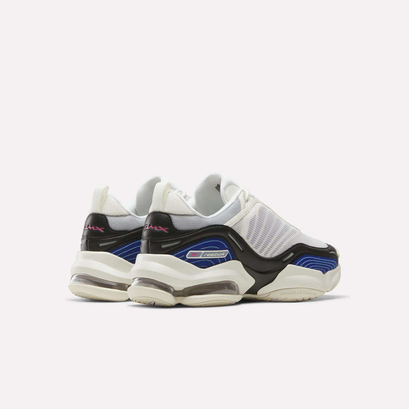A pair of Reebok DMX Series 3000 Shoes in white, black, and blue are displayed with the heels facing forward, featuring chunky soles with DMX moving air technology and mesh uppers against a plain white background.