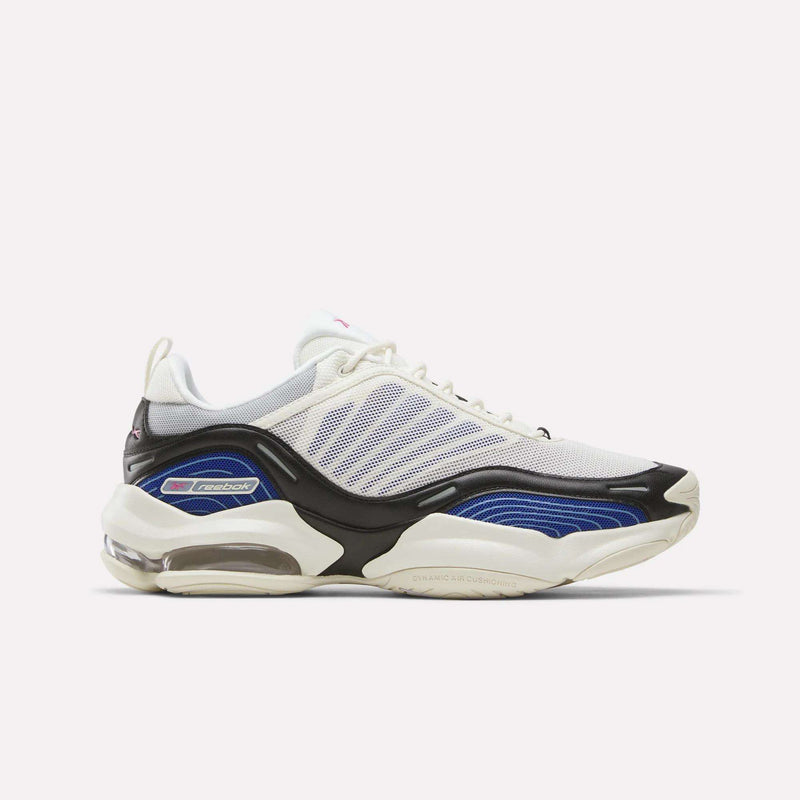 The Reebok DMX Series 3000 Shoes, shown in Chalk/Vector Blue/Black, feature a chunky sole and innovative DMX moving air technology for exceptional cushioning. Reebok branding stands out on the side of this athletic sneaker, displayed against a plain white background.