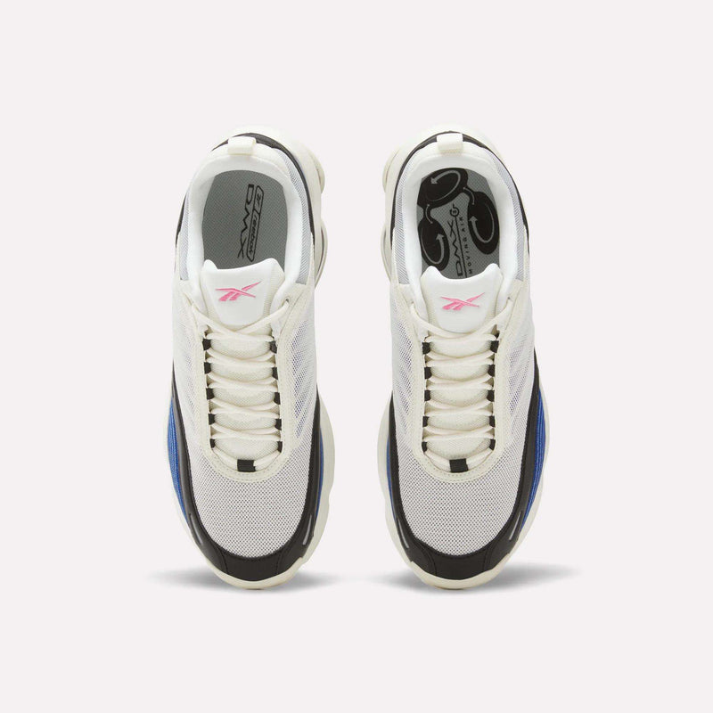 A top view of the Reebok DMX Series 3000 Shoes in white, featuring black, blue, and pink accents. The shoes are positioned side by side on a plain light background, highlighting their mesh uppers and thick, textured soles engineered with DMX moving air technology for superior cushioning.