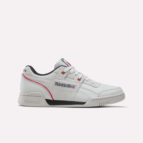 A side view of the Reebok Workout Plus Shoes in Grey 1/Black/Vector Red showcases vintage-inspired design with classic Reebok branding on the side and tongue, gray suede accents, black lining, and red trim—all set against a plain white background. These shoes merge timeless style with modern comfort.