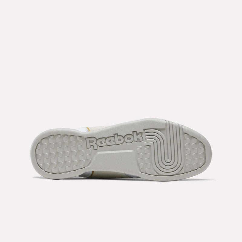 White Reebok Workout Plus sneaker sole featuring a textured tread pattern and a branded center.