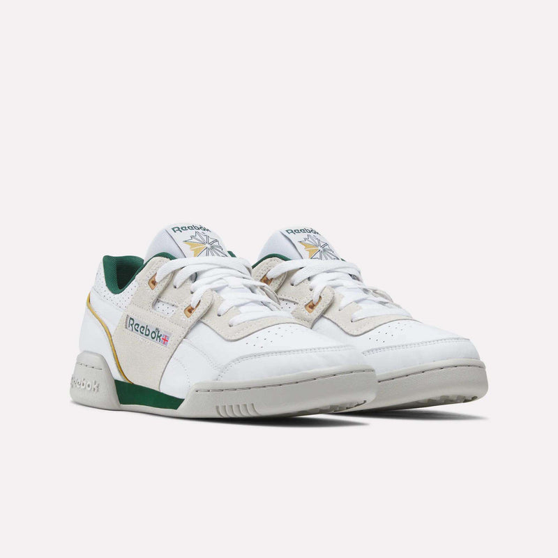 Retro-inspired Reebok Workout Plus shoes featuring white low-top construction, tan suede overlays, green accents, and a grey rubber sole.