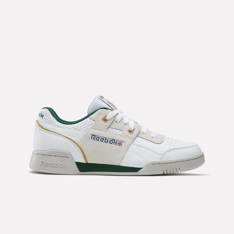 Reebok Workout Plus shoes, a retro-inspired white low-top sneaker featuring green accents, tan suede overlays, and a grey rubber sole.