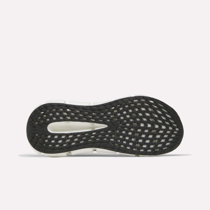 The image shows the black sole of the Reebok Men's FloatZig 2 Running Shoes with a white midsole and grid-like traction pattern, featuring Superfloat+ cushioning. The shoe is flat with the sole facing up on a plain white background.