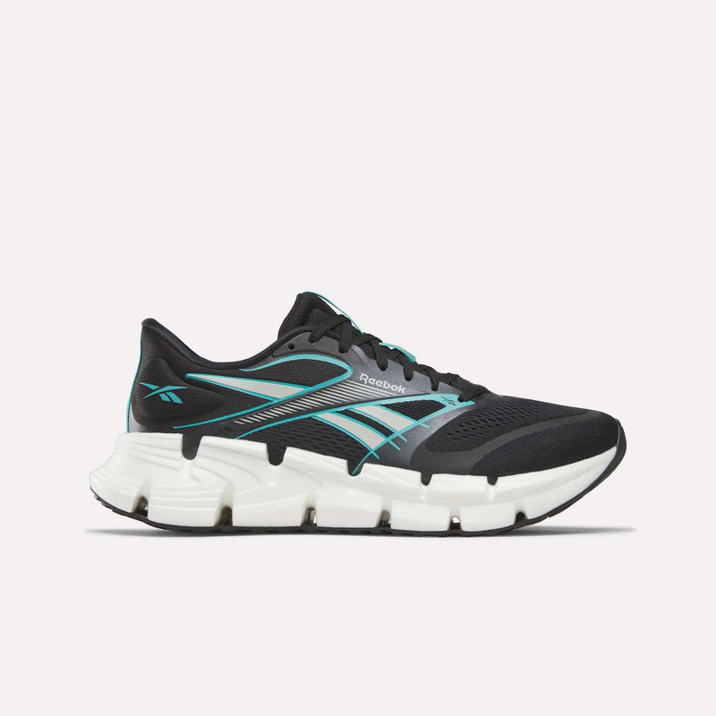 The Reebok Men's FloatZig 2 Running Shoes feature a black athletic design with teal accents and a thick, segmented white sole for energy-returning cushioning, shown in side profile against a plain light background.