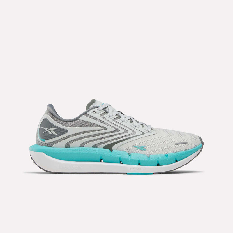 The Reebok Women’s FloatZig Tread Running Shoes in Grey/White are shown from the side on a plain white background—ideal women’s running shoes specifically designed for treadmill workouts.
