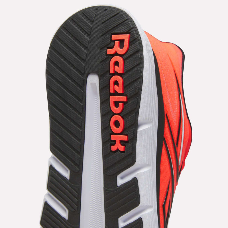 Close-up of the Reebok Nano Gym 2.0 Training Shoes' sole, featuring a black and white tread and vivid red Reebok logo, with a bright red upper and black accents for a bold gym-ready look.