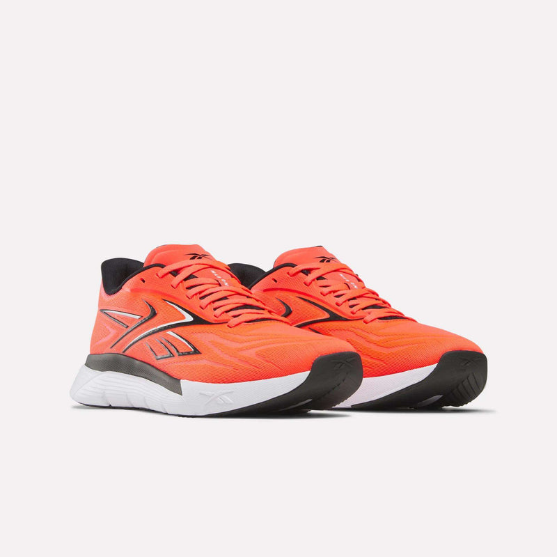 A pair of Reebok Nano Gym 2.0 Training Shoes in bright orange with black accents, high-rebound foam soles, and a large stylized logo on the sides, shown on a plain white background.