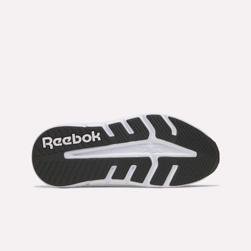 The image displays the black and white outsole of the Reebok Women's Nano Gym 2.0 Training Shoes, featuring a large white Reebok logo on the left side and a mix of textured and smooth sections for enhanced grip.