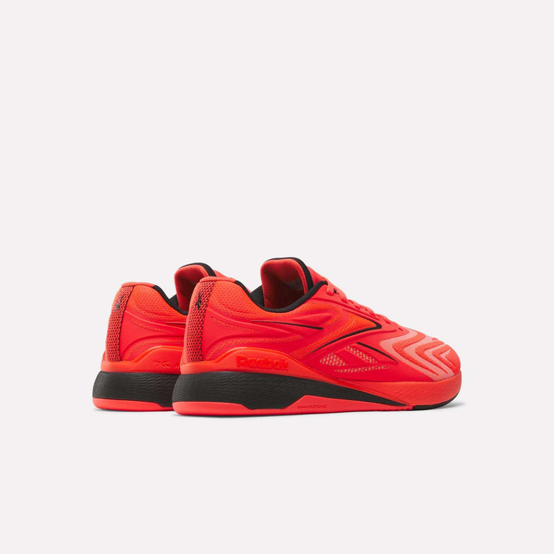 A pair of Reebok Nano X5 Edge Training Shoes in vibrant red with black soles, shown from the back and side on a plain white background. Engineered for peak performance, these Reebok shoes are ideal for intense training sessions.