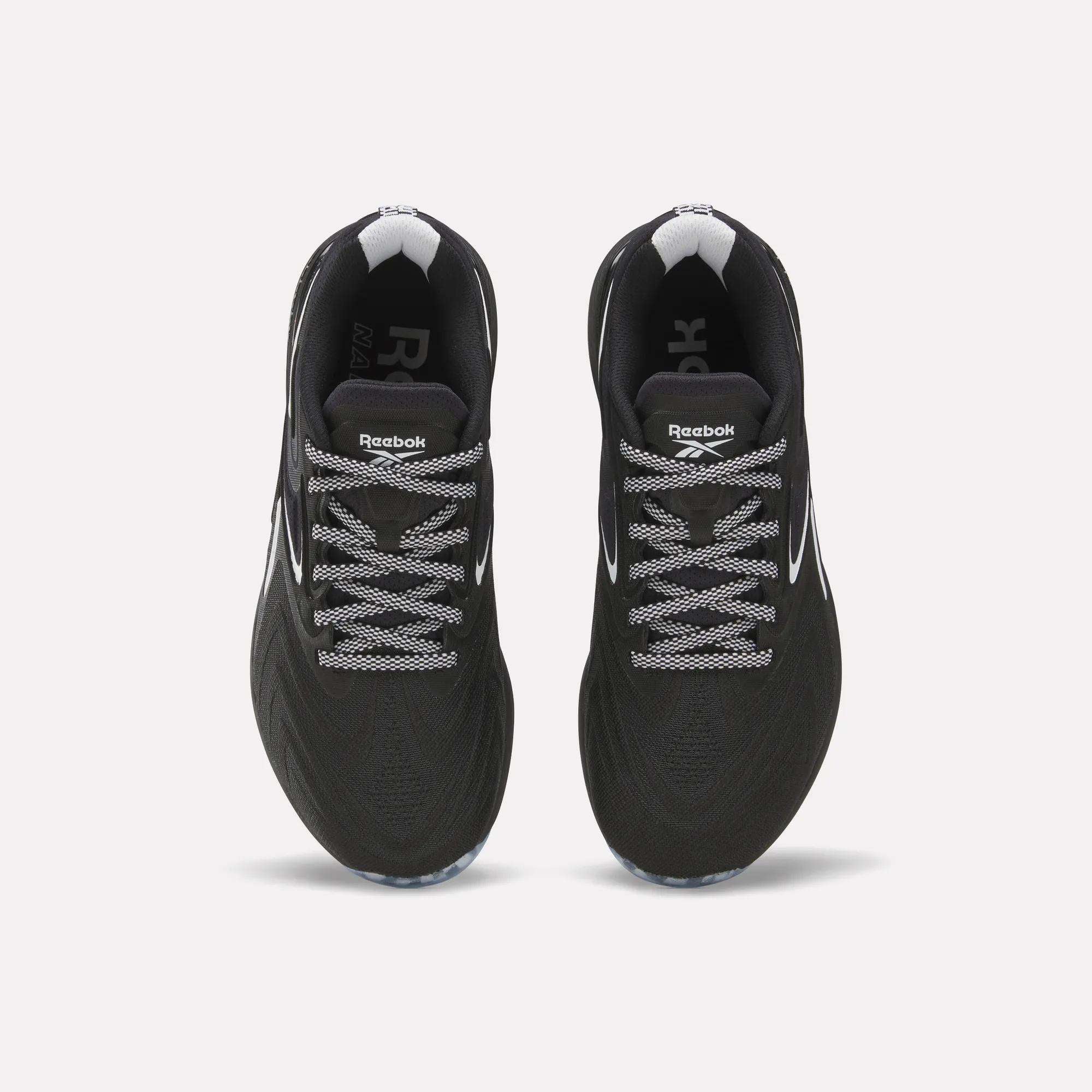 Top view of Reebok Women's Nano X5 Edge Training Shoes in black with white laces and accents, displayed side by side on a plain white background.
