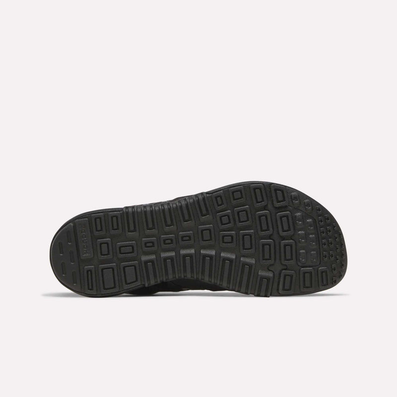 The image displays the black rubber sole of the Reebok Women’s Nano 2.0 Training Shoes, showcasing a geometric tread pattern with rectangular and square shapes for improved grip—ideal for functional fitness and fans of Reebok training footwear.