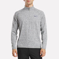 Person wearing a gray long-sleeve shirt with a brand logo on a white background