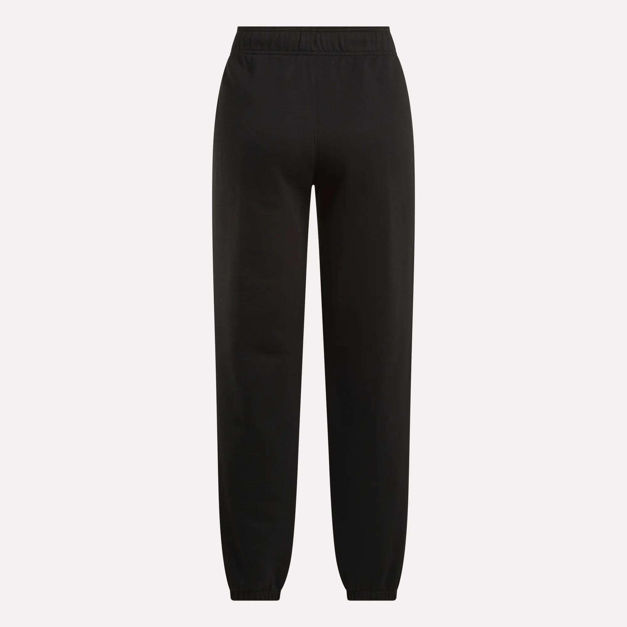 The Reebok Women's Medium Vector Sweatpants, made from a comfy cotton-blend with an elastic waistband and ankle cuffs, are showcased against a plain light background.