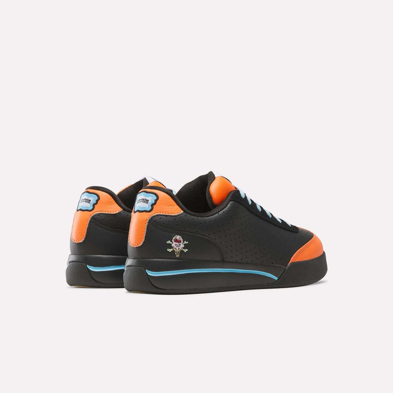 Black and orange Reebok x Icecream Board Flip low-top suede sneakers featuring a small ice cream cone graphic on the heel and a blue accent stripe along the sole.