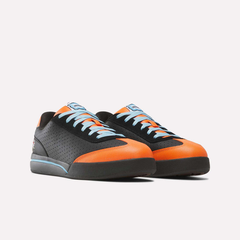 Black and orange Reebok x Icecream Board Flip low-top skate shoes with light blue laces and a thick dark sole.