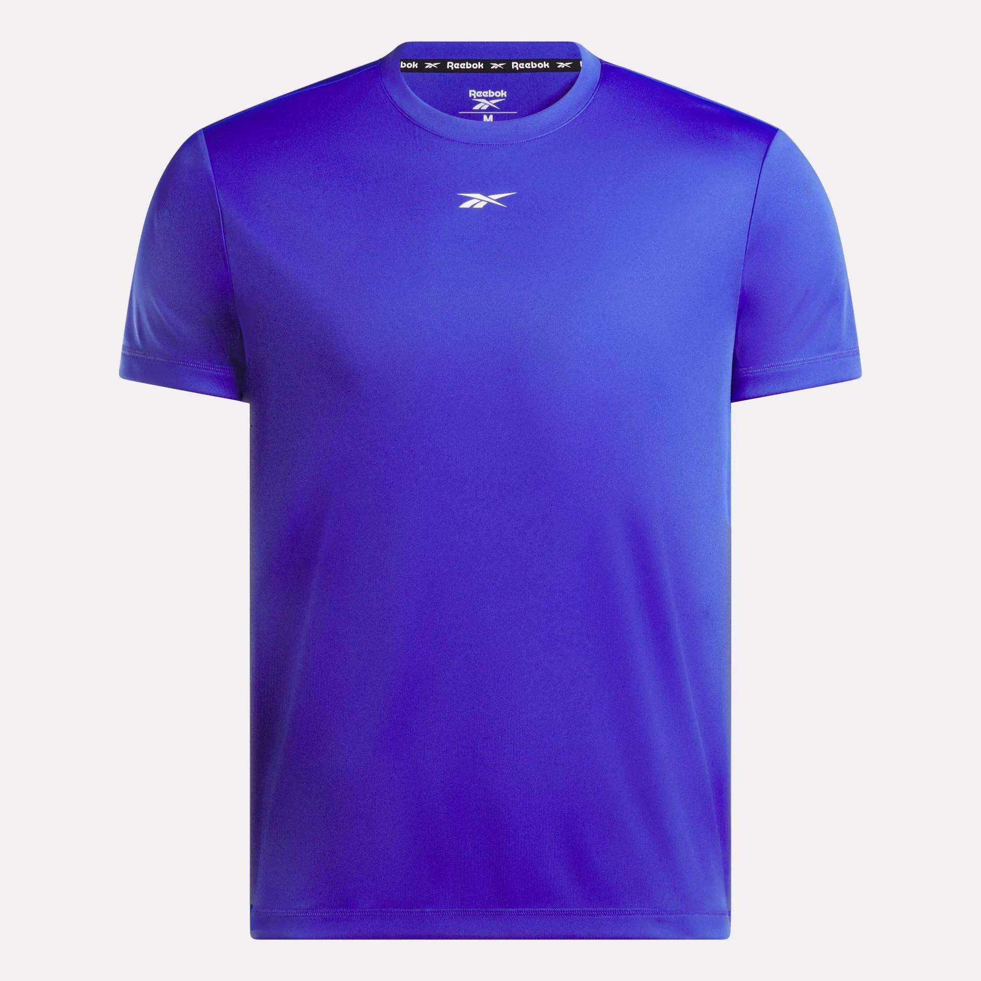 The Men's Short Sleeve Tech Training T-Shirt by Reebok is shown in royal blue with a classic crew neckline, sweat-wicking fabric, and the white Reebok logo at the chest, set against a white background.