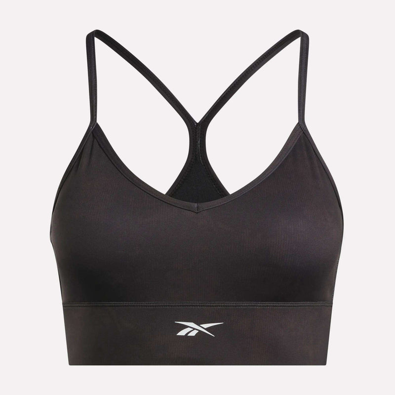 The Reebok Women's Printed Tri-Back Sports Bra features thin racerback straps and a white Reebok logo on the front, shown against a plain white background. Designed with sweat-wicking fabric, this workout bra keeps you comfortable and dry during your most intense sessions.