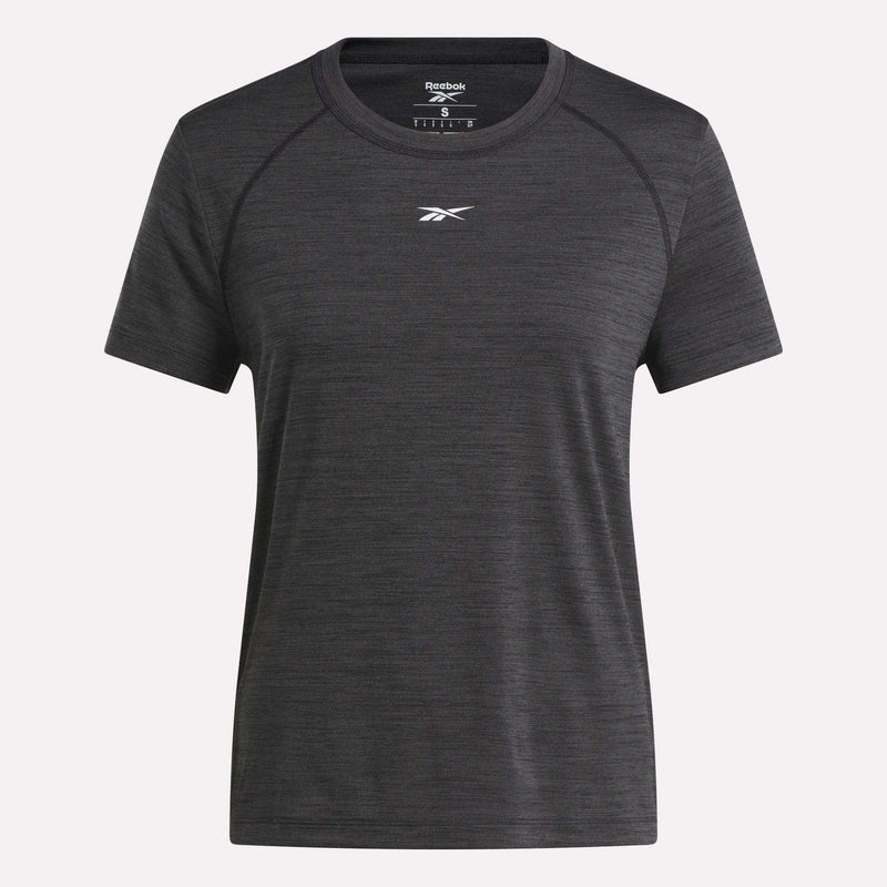 A women's Reebok Training T-Shirt in dark grey is shown on a white background. This short-sleeved tee has a crew neckline and features a small white Reebok logo on the chest.
