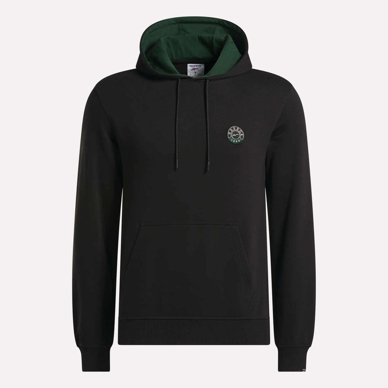 The Reebok Men's French Terry Hoodie is crafted from comfortable French terry fabric and features a black design with a green-lined hood, adjustable drawstrings, a convenient front pocket, and a small circular logo on the left chest. The hoodie is shown against a plain light background.