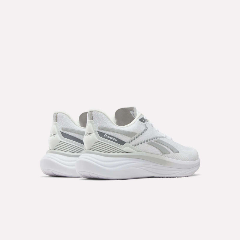 A pair of Men's Viva Speed Shoes by Reebok is displayed on a white background, angled to showcase the sides and back. These white shoes with gray accents offer breathable construction and cushioned support, making them ideal for athletic activities and everyday comfort.