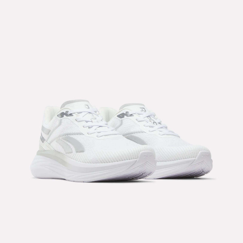 A pair of Men's Viva Speed Shoes by Reebok in white with subtle gray accents, showcasing a cushioned and breathable design, viewed from a front angle and set against a plain white background.