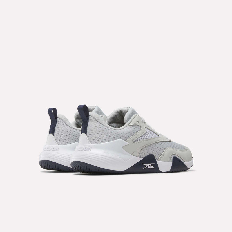 Light gray Reebok Men’s Phase Advantage Tennis Shoes with mesh uppers, dark navy accents, and white soles.