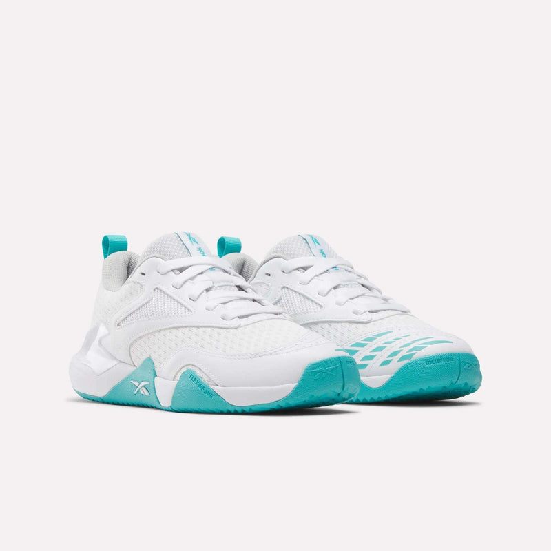 White Reebok Women’s Phase Advantage Tennis Shoes with teal accents and a textured rubber sole.