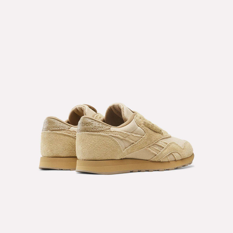 A rear three-quarter view of tan Reebok x Avatar Classic Nylon Shoes, featuring a mix of suede and textile materials.