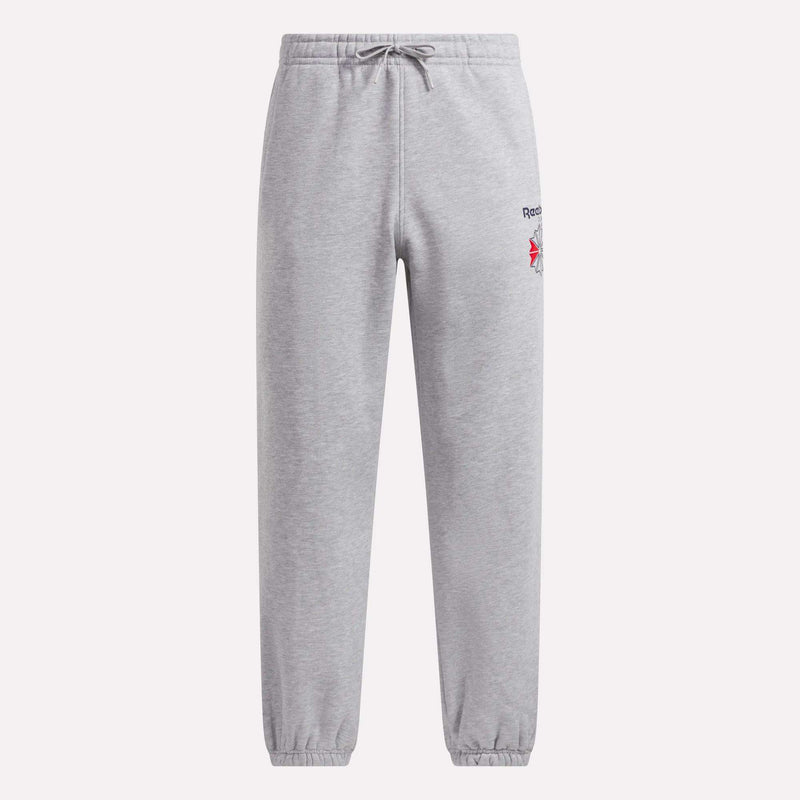 Men’s Relaxed Logo Joggers by Reebok in light gray, featuring an elastic waistband with a drawstring, elastic cuffs, and crafted from soft fleece. These sweatpants showcase a small embroidered Reebok logo and a bold red design on the upper left thigh.