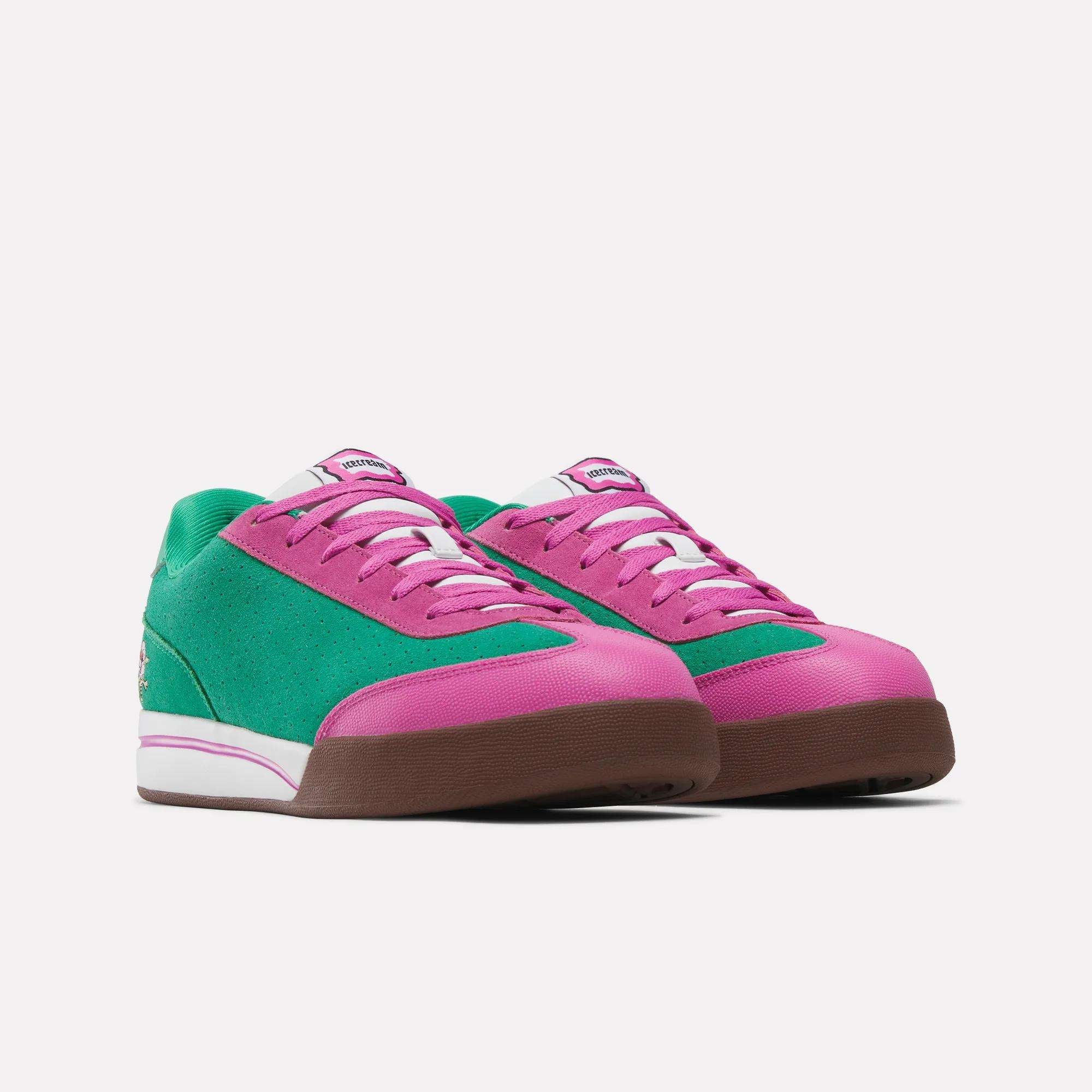 The Reebok x BBC Board Flip Skate Shoes by Reebok feature green sides, pink toe caps and tongues, white laces, and brown soles in an early-2000s low-top skate style, shown on a white background.