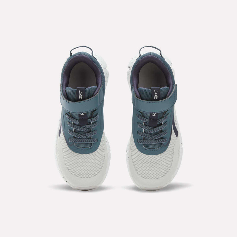 A top-down view of the Reebok Zig Dynamica 6 Running Shoes for little kids in teal and white. These shoes feature Zig technology, a combination of laces and velcro strap, a textured sole, and a dark inner lining to provide enhanced comfort and support.