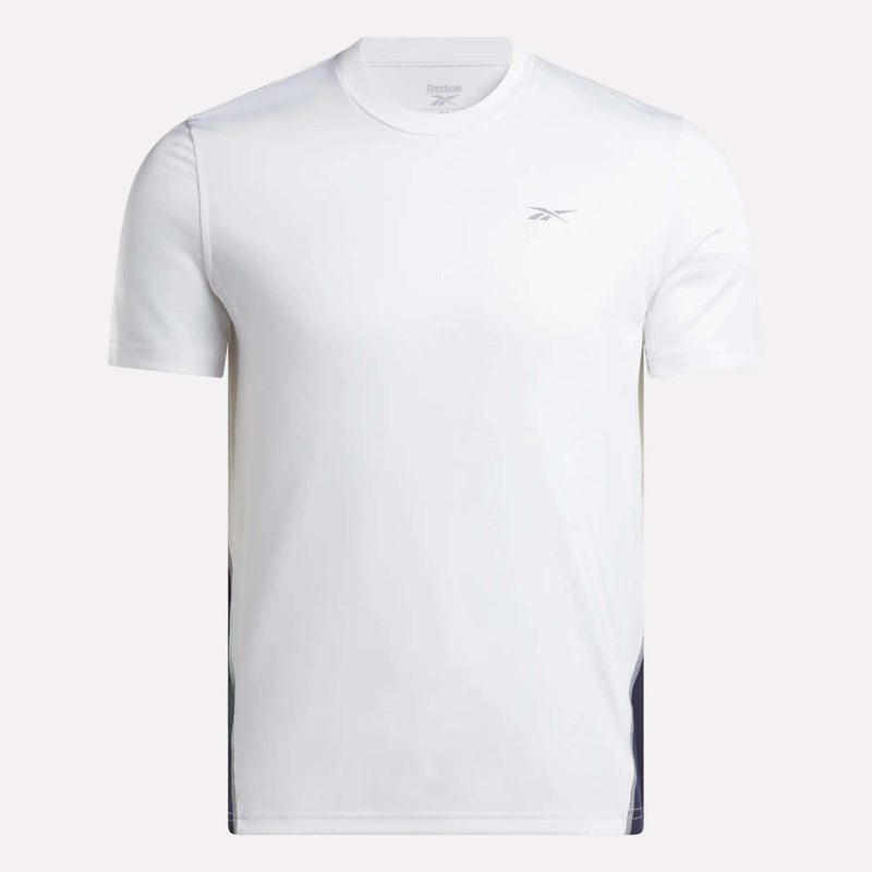 A Men’s Short Sleeve Vector T-Shirt by Reebok, featuring a simple white design and a small Reebok logo on the left chest, is shown against a neutral background. Made with RBK-DRY technology, this men’s mesh tee helps keep you cool and comfortable during every workout.
