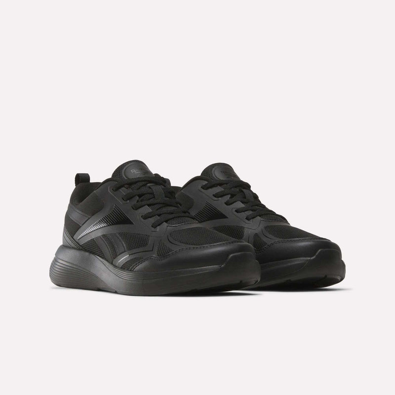 The Reebok Rush Runner 6.0 Running Shoes for big kids are sleek black athletic shoes with mesh panels, thick rubber soles, and an EVA midsole, shown side by side on a plain white background.