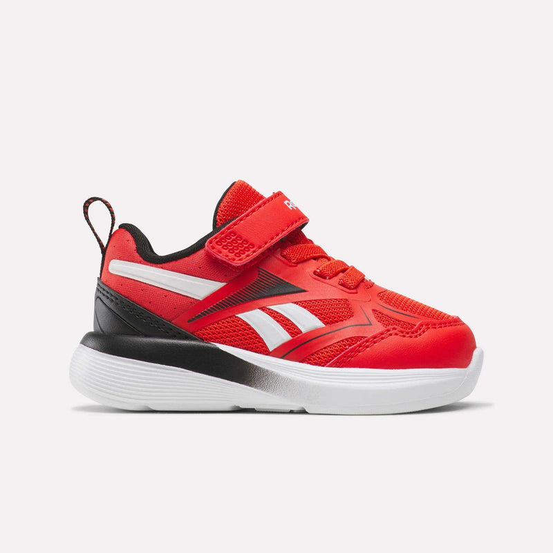 The Reebok Rush Runner 6.0 Gore Lace Top Strap Running Shoes for baby and toddler feature a Rival Red/Black/Ftwr White colorway, mesh and synthetic upper, EVA cushioning, hook-and-loop strap, and a comfy white sole.