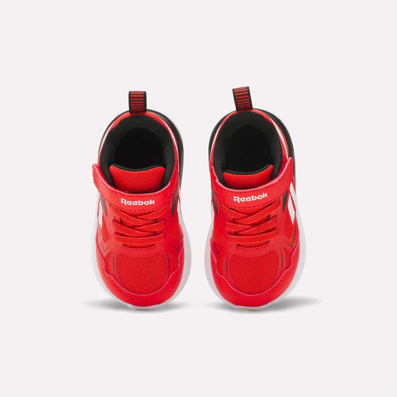 The Reebok Rush Runner 6.0 Gore Lace Top Strap Running Shoes for baby and toddler boys feature bright red mesh uppers, white accents, Velcro straps, pull tabs, and EVA-cushioned white soles, shown from above on a plain white background.