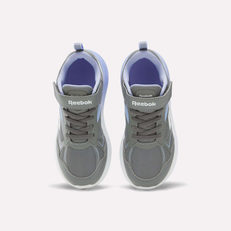 A pair of Reebok Rush Runner 6.0 Elastic Lace Top Strap Running Shoes for little kids, featuring gray and white colors with laces and Velcro straps, designed for all-day comfort, viewed from above on a plain white background.