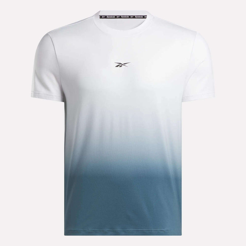 The Reebok Men's Athlete Speed Ombré T-Shirt is a stylish short-sleeve gym shirt with a white top that fades into blue and features a small Reebok logo centered on the chest.