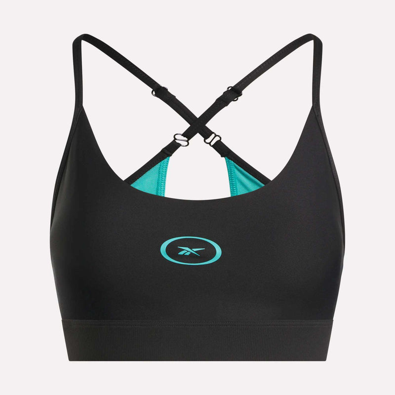 The Reebok Women's Speed Strappy Sports Bra features a black design with adjustable criss-cross straps, turquoise inner lining, and a turquoise Reebok logo on the front center, displayed on a plain light background.