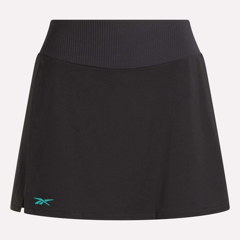 The Reebok Women's Athlete Speed Skort 3" is a black skort featuring a wide ribbed waistband, built-in shorts, and a small teal Reebok logo by the left hem. Its sleek design offers effortless style and comfort.